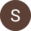The letter S in a brown circle
